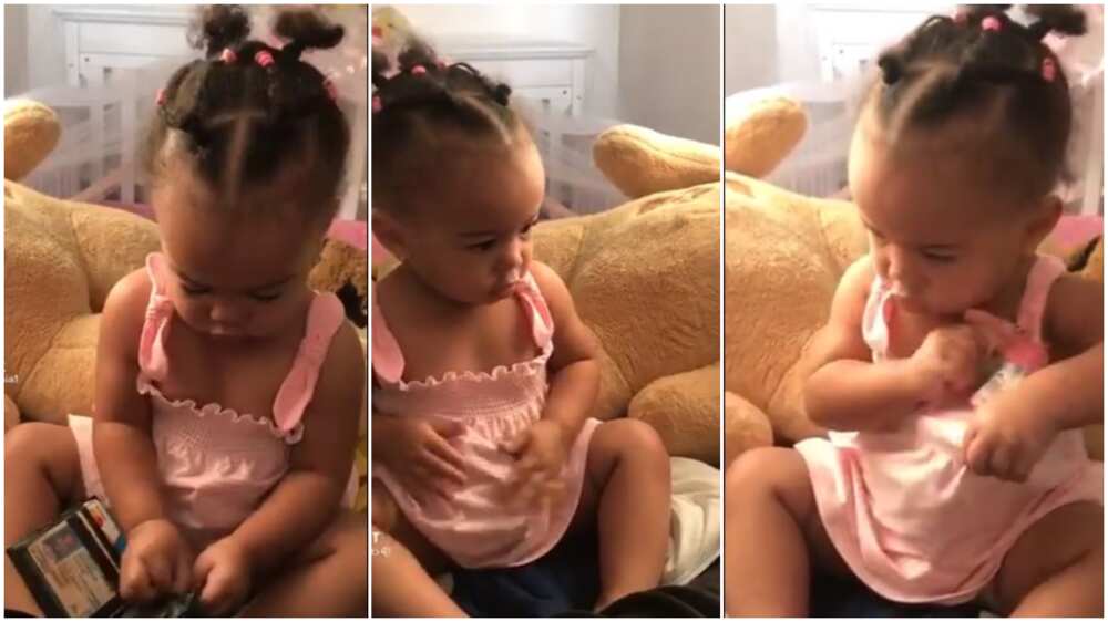 Little baby takes money from a wallet, put it inside her cloth like an adult, video stirs reactions