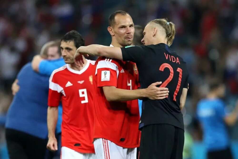 Russia's Sergei Ignashevich being consoled by Croatia's Vida after their quarterfinal exit at the ongoing World Cup. Photo Credit: Getty images
