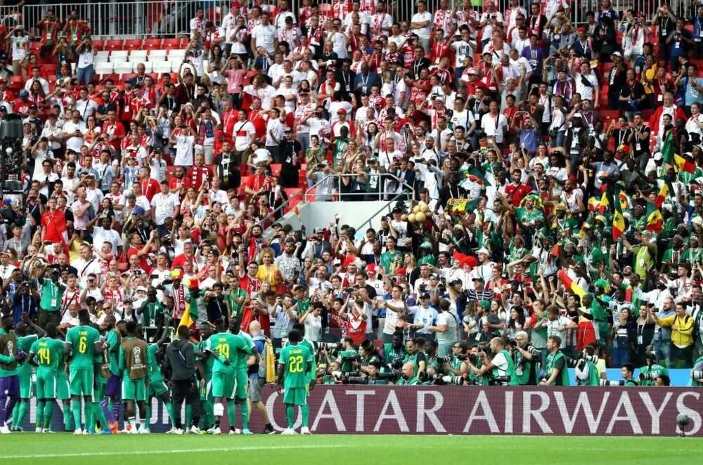 Teranga Lions’ supporters clean stadium at the end of Senegal, Poland match