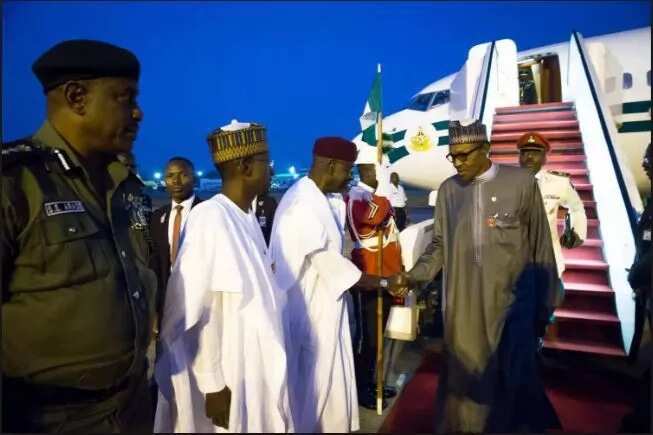 Buhari returning from a previous trip / File Photo