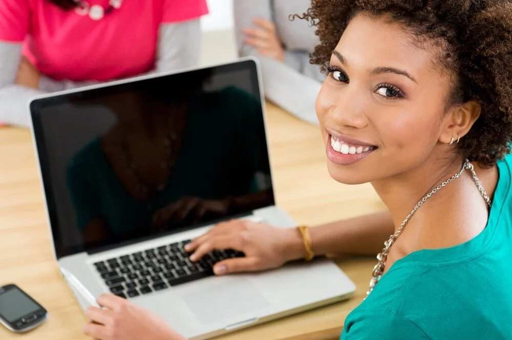 Smiling woman and laptop