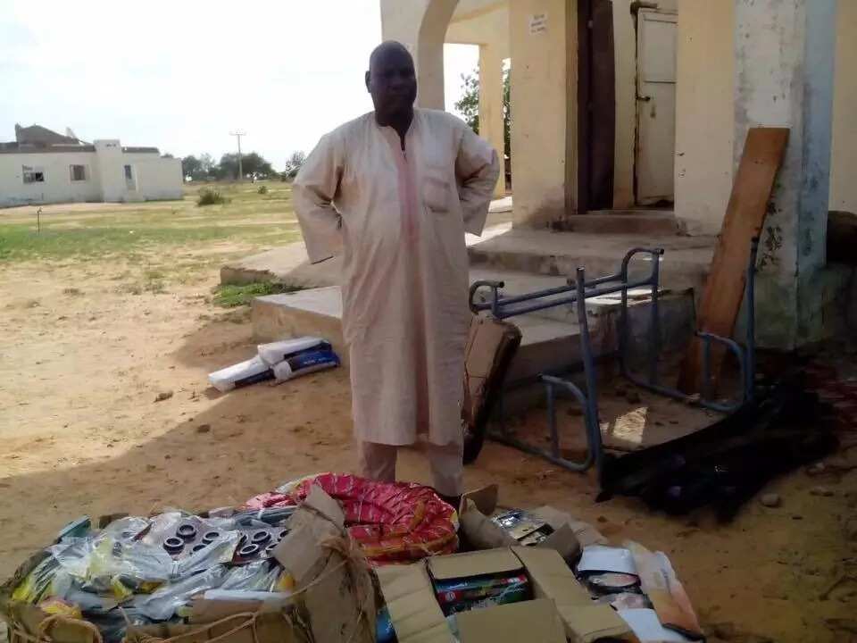 Hassan Yusuf and the recovered items. Photo credit: SK Usman