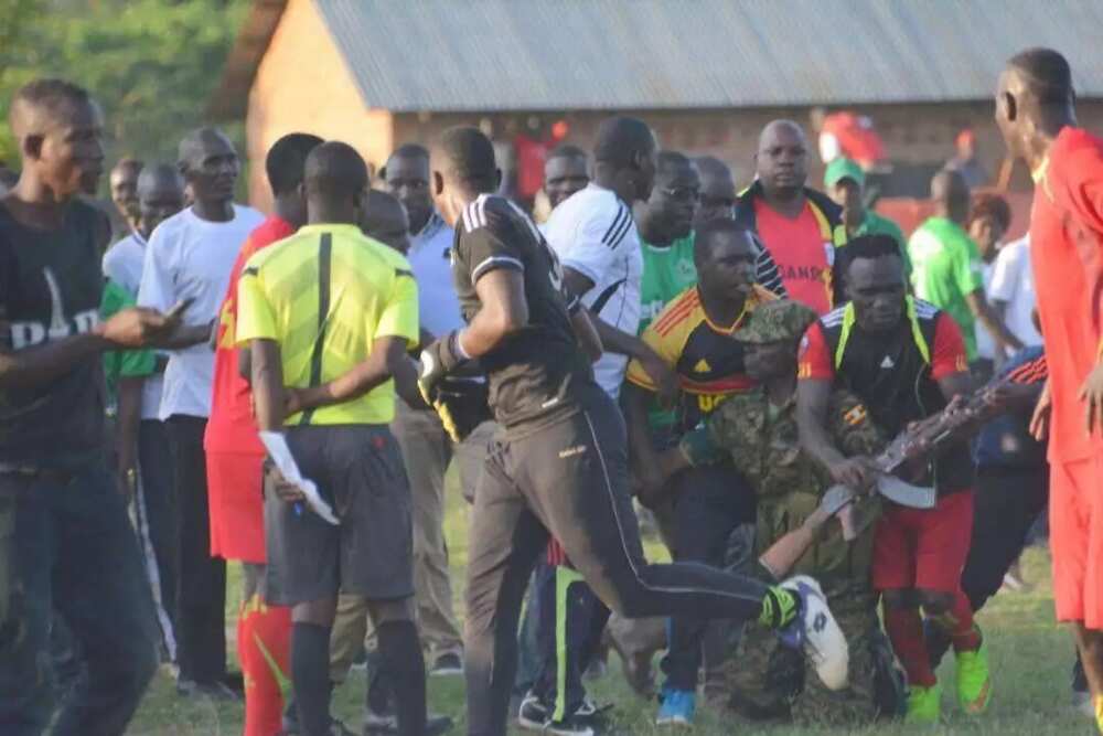 Football fans stop soldier from shooting AK47 after his team lost a match in Uganda