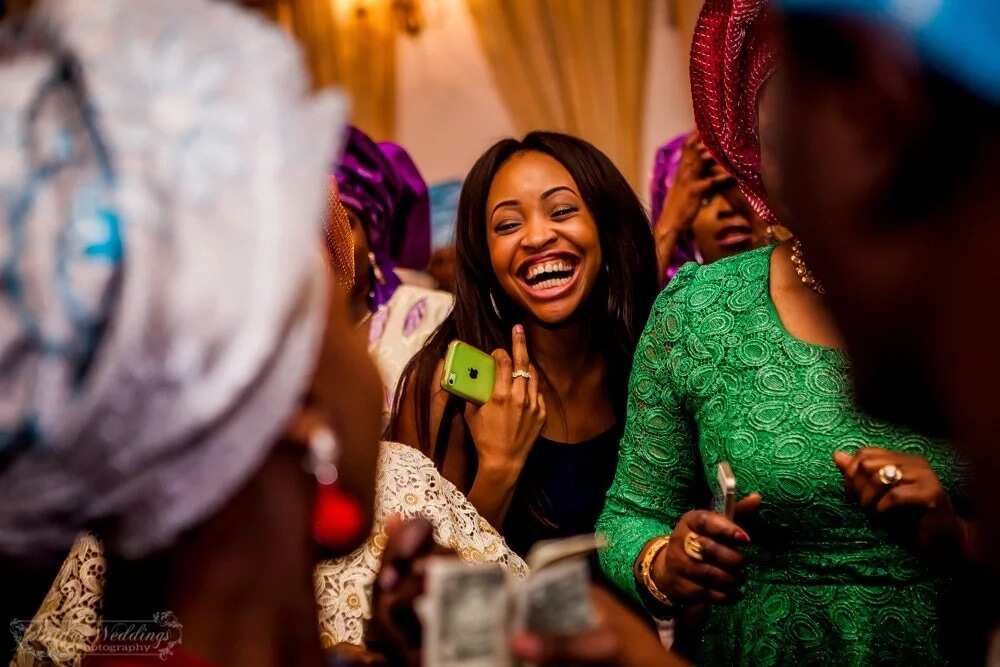 Nigerian wedding - guests laugh