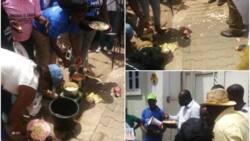 Protesting group occupies, cooks yam, noodles in front of Amnesty International office in Abuja (photos)