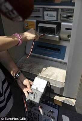 Chinese Woman Gets Electrocuted By ATM