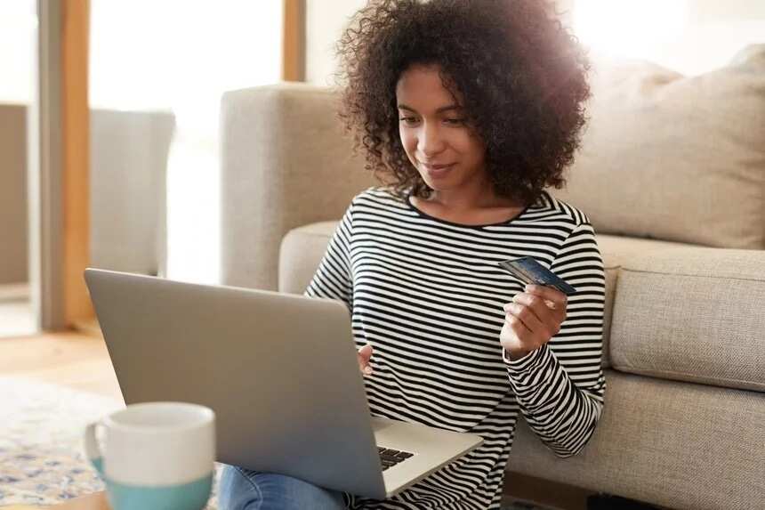 Girl on laptop with credit card