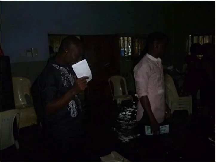 Members of a church worship inside a flooded arena in Port Harcourt