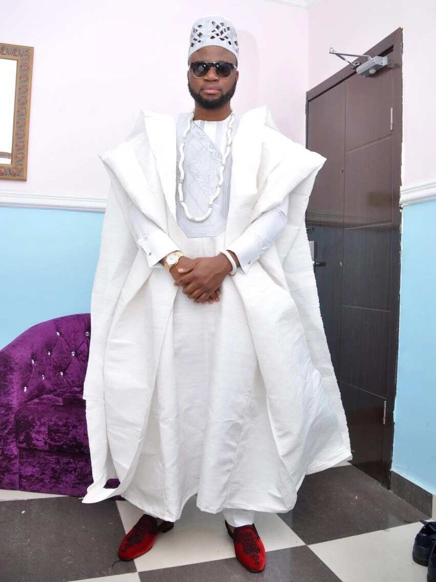 White Agbada style for guys with volume in the shoulder line