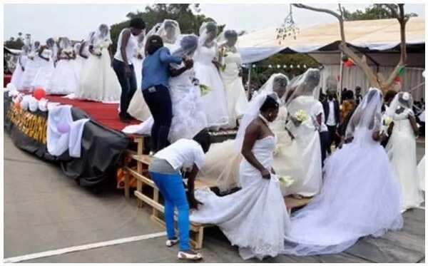 200 brides ride in a truck to their mass wedding in Uganda