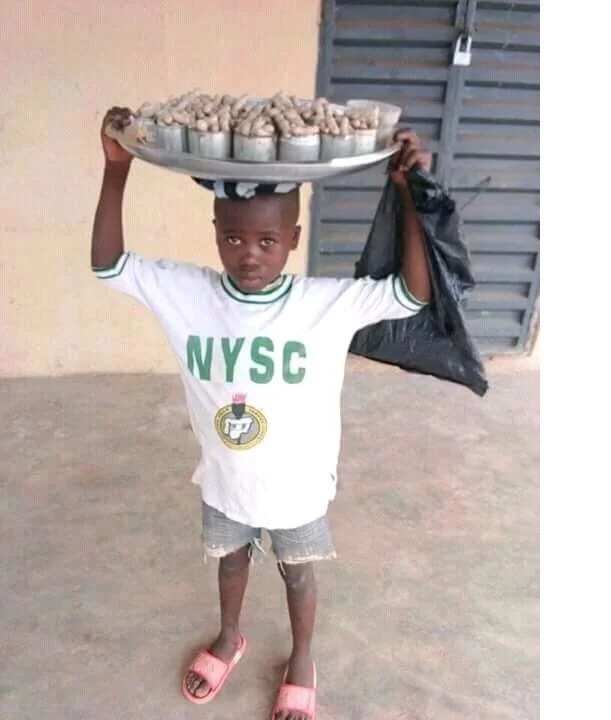 Little boy wears NYSC uniform to hawk groundnut (photo)