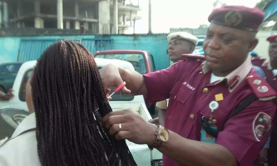 FRSC Sector Commander cutting off female officers' hairs