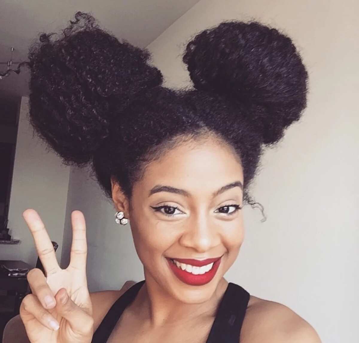 Black natural hairstyles for medium length hair Legit.ng