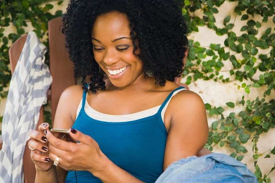 Happy woman texting