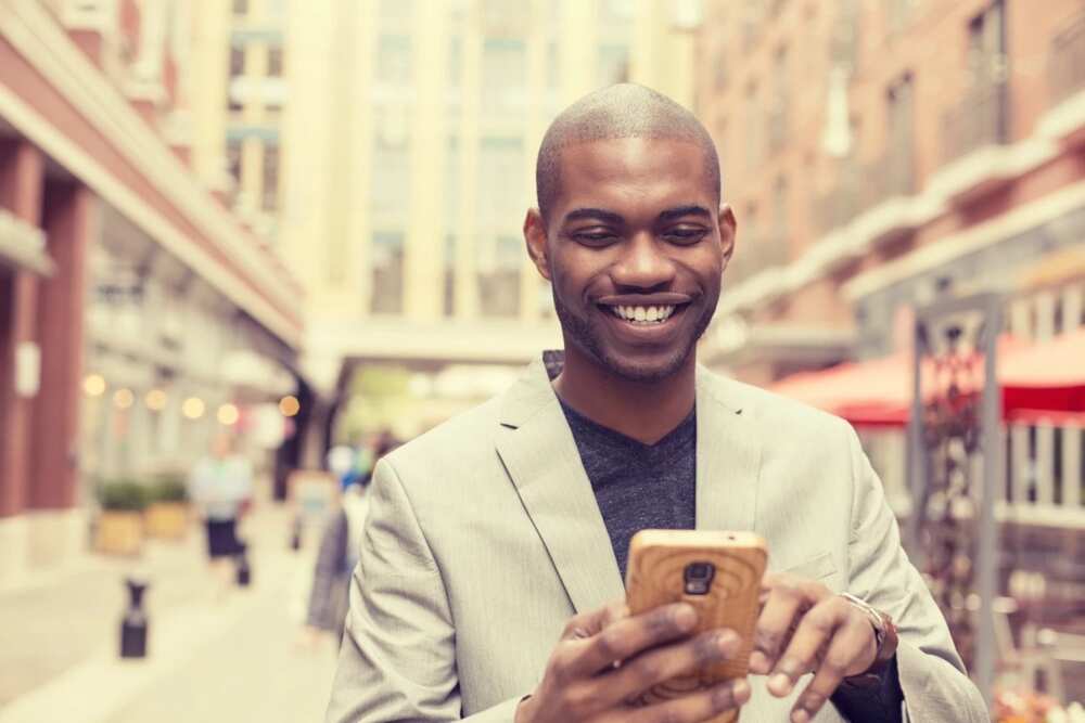 A black man with a phone