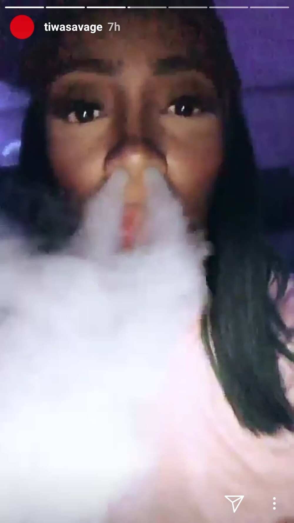 Rare photos of singer Tiwa Savage partying and smoking shisha in a club (photos)