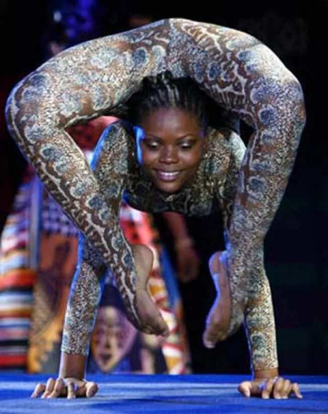 See pictures of the woman tagged 'snake woman of Africa'