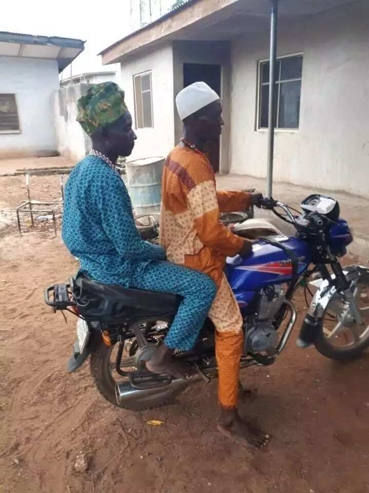 Some of the suspects showing the police how they ride with the rifle under the seat. Photo source: Abba Kyari