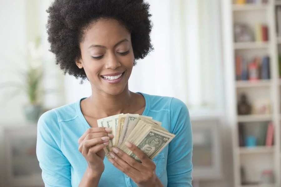 Happy woman with money