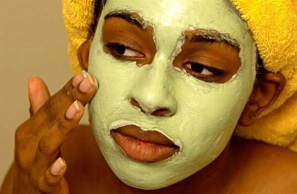 woman applying face mask