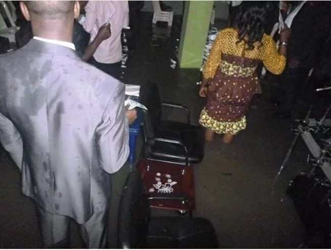 Members of a church worship inside a flooded arena in Port Harcourt