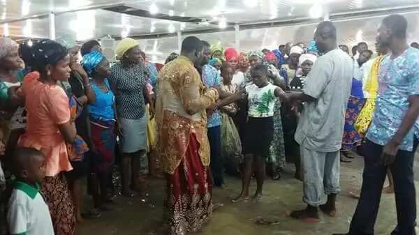 Nigerian prophet and his members worship in waterlogged church (photos)