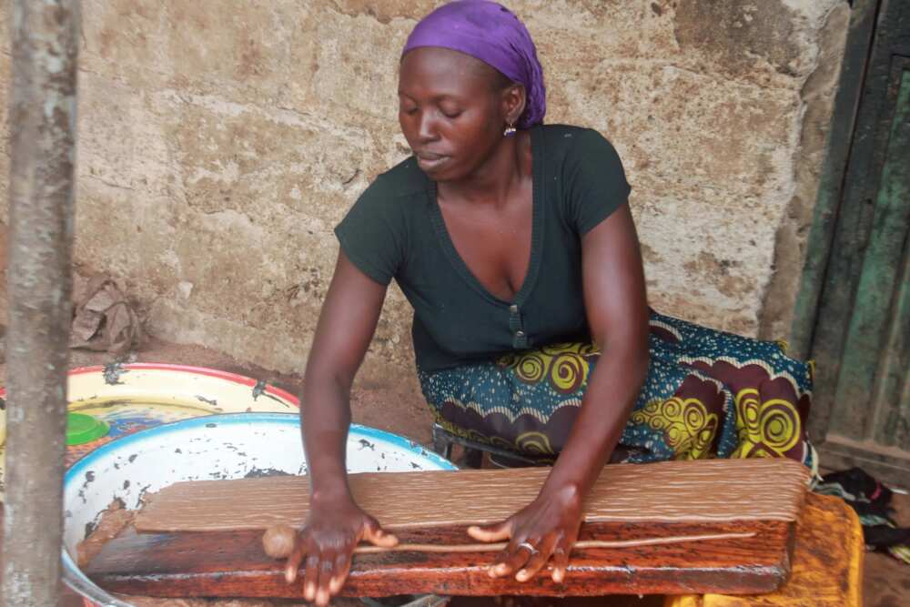 Nigerian woman cooking kuli kuli