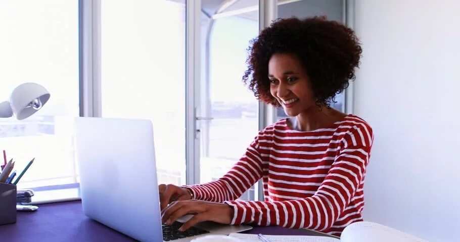 Smiling woman on laptop
