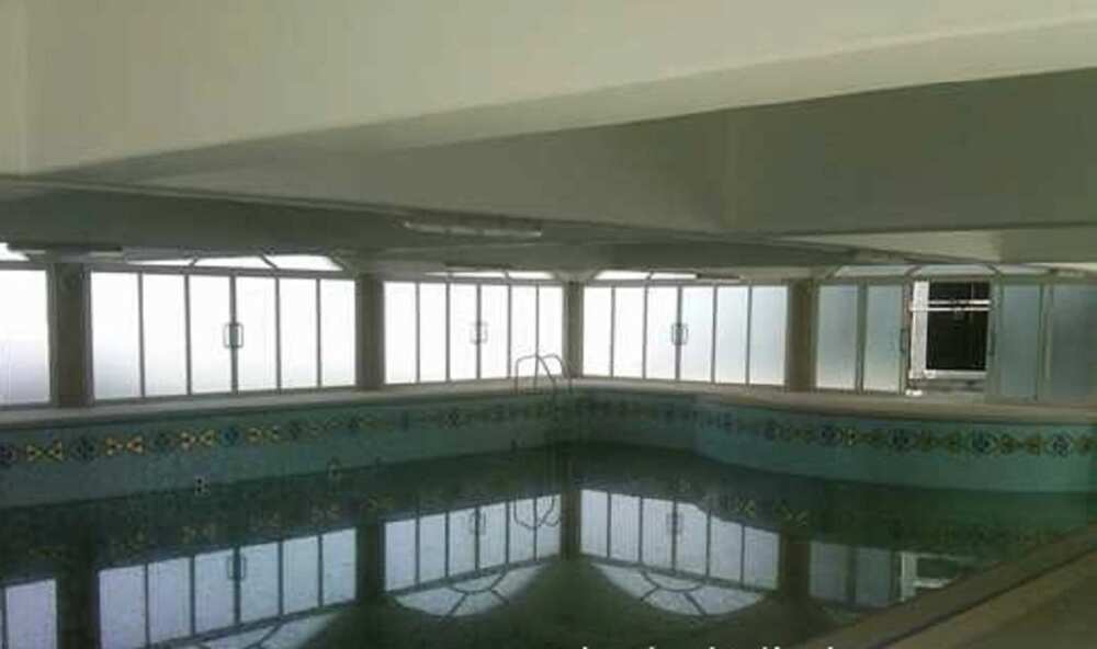 Mike Adenuga indoors swimming pool