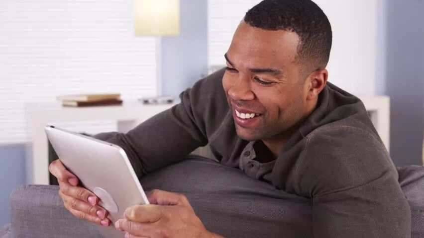 Happy man on a laptop