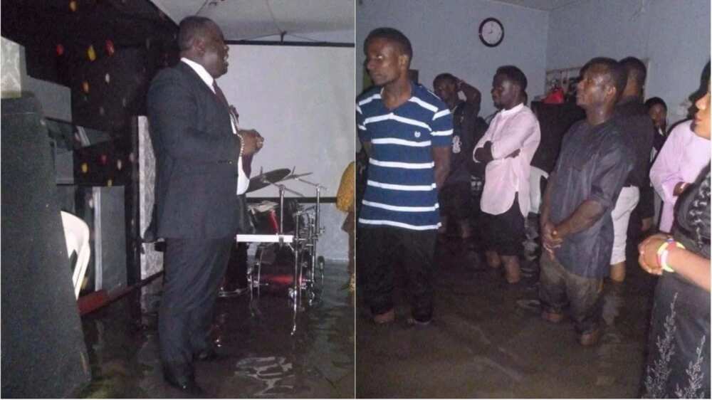 Members of a church worship inside a flooded arena in Port Harcourt