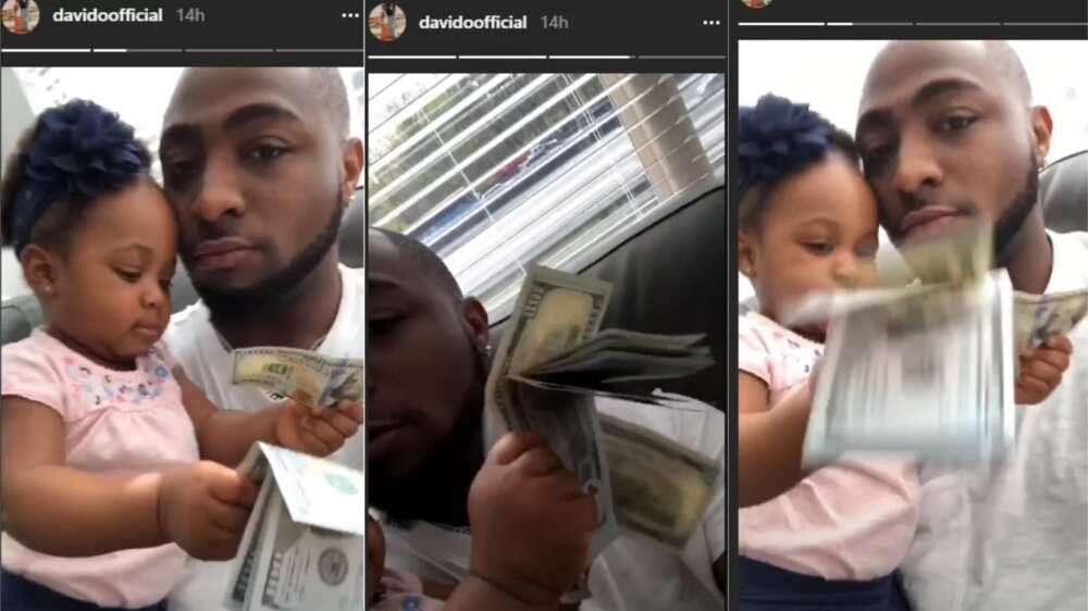 Davido’s second daughter Hailey plays with bundle of 100 dollar bills (photos)