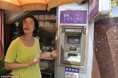 Chinese Woman Gets Electrocuted By ATM