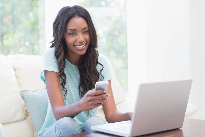 Girl with phone and laptop