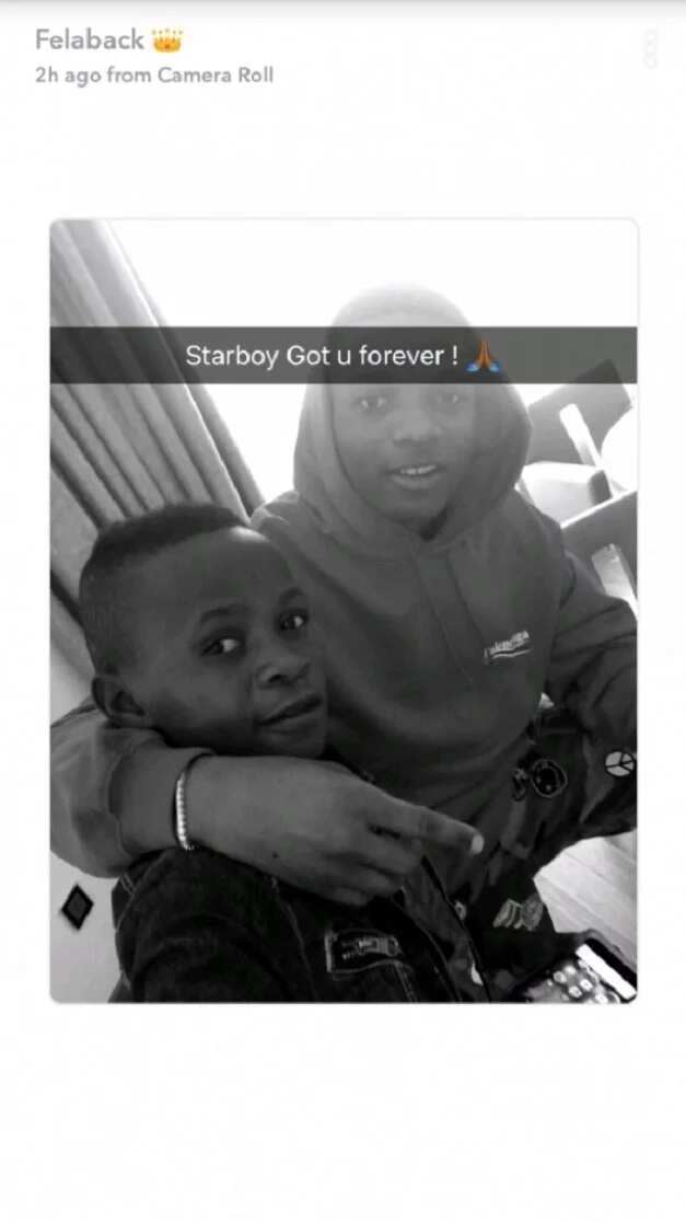 Wizkid poses with his latest signee Ahmed in new photos