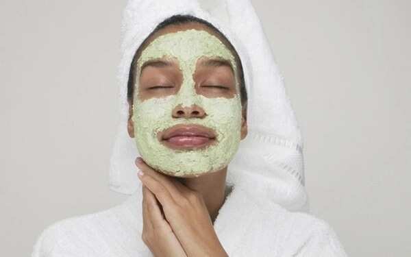 woman with green face mask