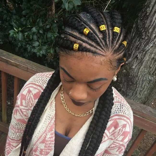 Nigerian braids with golden accessories for round face