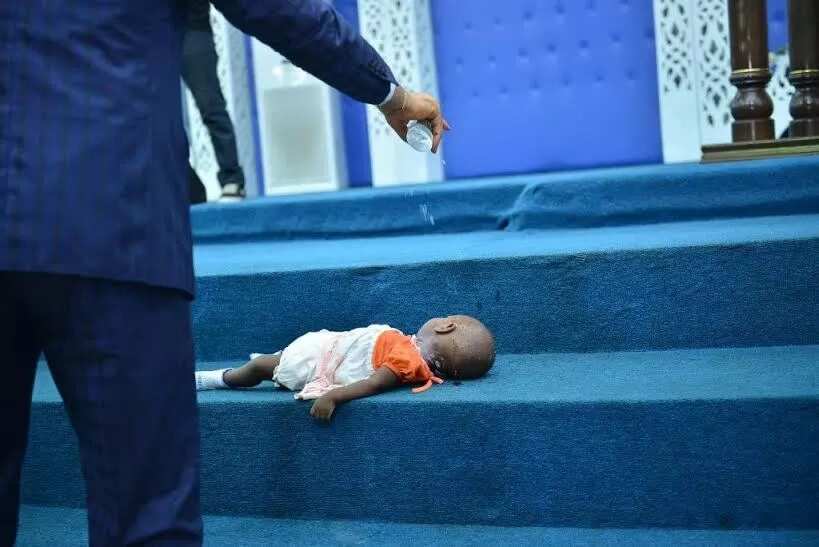 Dead baby raised to life (photos)